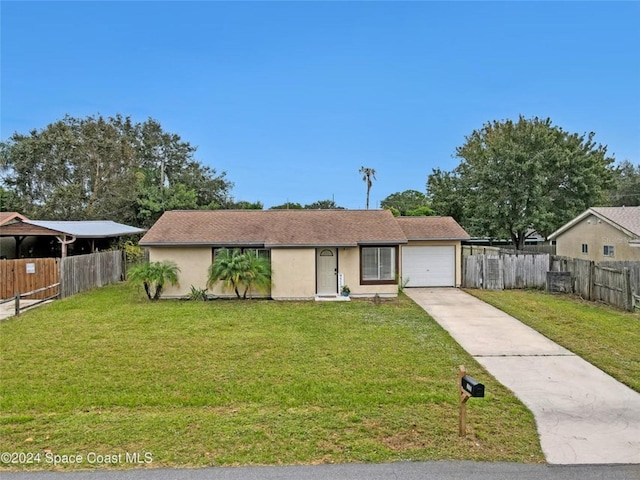 view of front of home featuring a front lawn and a garage