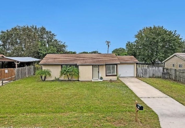 view of front of home featuring a garage and a front yard