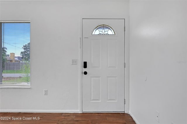 foyer entrance with dark wood-type flooring