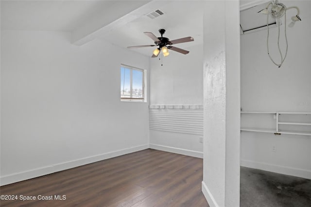 unfurnished room featuring ceiling fan, beamed ceiling, and dark wood-type flooring