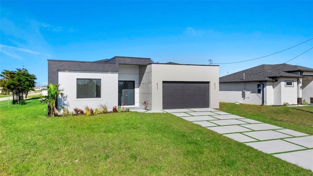 view of front of house with a garage and a front yard