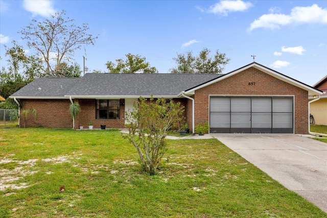 single story home with a garage and a front yard