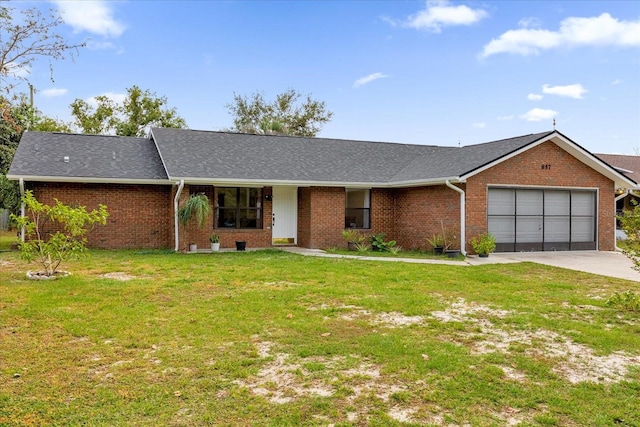 ranch-style home featuring a front yard and a garage