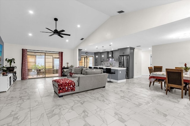 857 S Atmore Cir, Deltona, FL 32725 - living room with light marble finish floors, ceiling fan, recessed lighting, and high vaulted ceiling