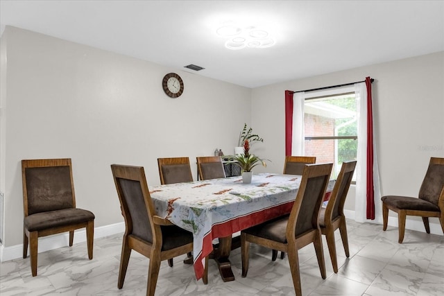 857 S Atmore Cir, Deltona, FL 32725 - dining space featuring light marble finish flooring and baseboards
