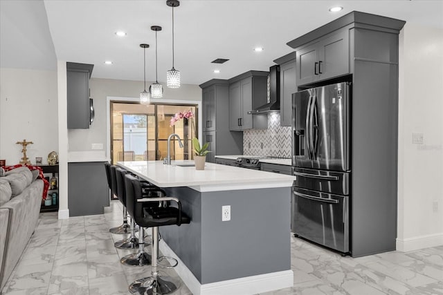 857 S Atmore Cir, Deltona, FL 32725 - kitchen featuring stainless steel fridge with ice dispenser, wall chimney range hood, light marble finish flooring, light countertops, and tasteful backsplash