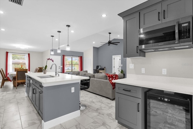 857 S Atmore Cir, Deltona, FL 32725 - kitchen with beverage cooler, stainless steel microwave, light marble finish flooring, gray cabinets, and recessed lighting