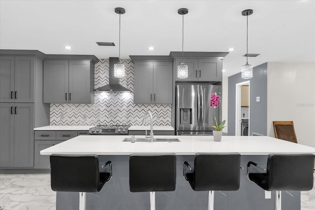 857 S Atmore Cir, Deltona, FL 32725 - kitchen featuring appliances with stainless steel finishes, wall chimney range hood, gray cabinetry, and recessed lighting