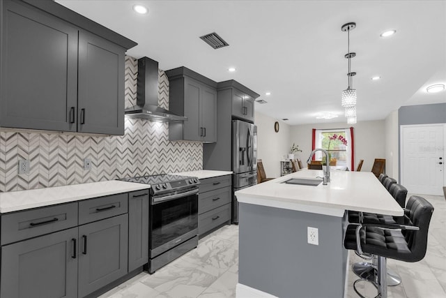 857 S Atmore Cir, Deltona, FL 32725 - kitchen with appliances with stainless steel finishes, wall chimney exhaust hood, light marble finish floors, light countertops, and recessed lighting
