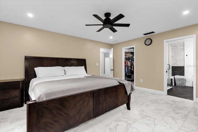 857 S Atmore Cir, Deltona, FL 32725 - bedroom with light marble finish floors, recessed lighting, a walk in closet, connected bathroom, and ceiling fan