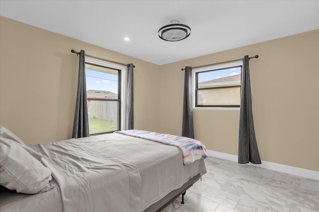 857 S Atmore Cir, Deltona, FL 32725 - bedroom featuring light marble finish floors, multiple windows, and recessed lighting