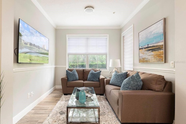 living room with light hardwood / wood-style flooring and ornamental molding