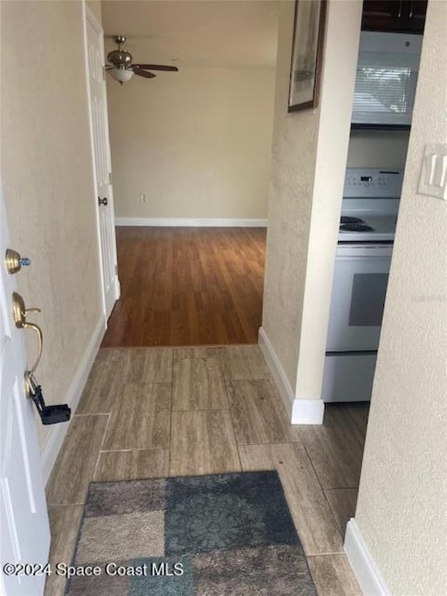 corridor with dark wood-type flooring