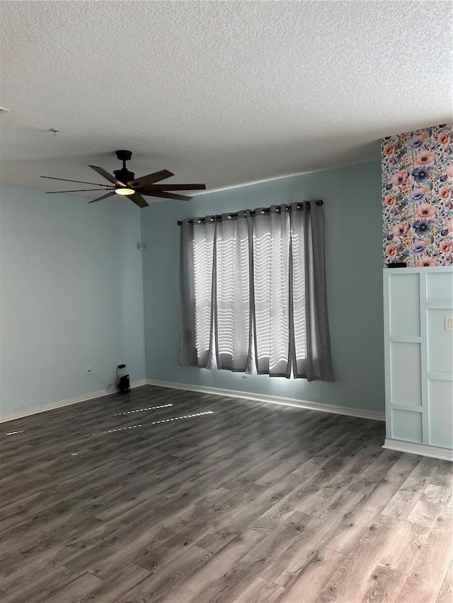 3031 San Jacinto Cir Unit 3031, Sanford, FL 32771 - unfurnished living room featuring a textured ceiling, ceiling fan, wood finished floors, and baseboards
