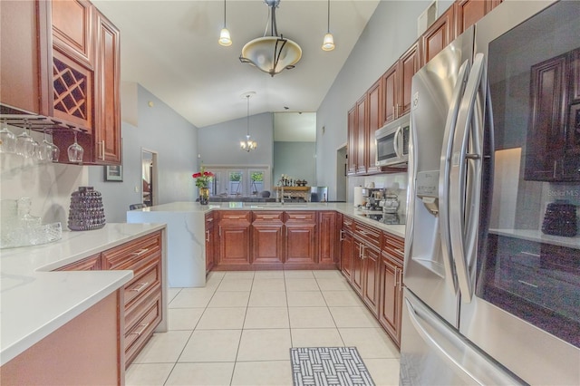 kitchen with pendant lighting, high vaulted ceiling, light tile patterned flooring, stainless steel appliances, and a chandelier