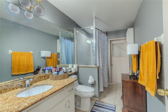 bathroom with walk in shower, tile patterned flooring, a textured ceiling, toilet, and vanity