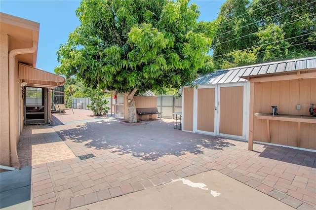 view of patio / terrace with a storage unit