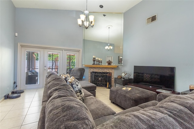 living room featuring french doors, high vaulted ceiling, a notable chandelier, and light tile patterned flooring