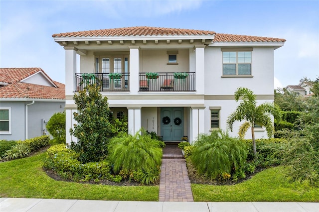 mediterranean / spanish-style home with a balcony