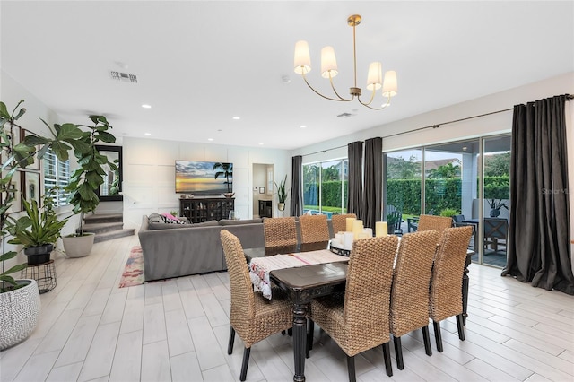 dining room featuring light hardwood / wood-style flooring and a chandelier