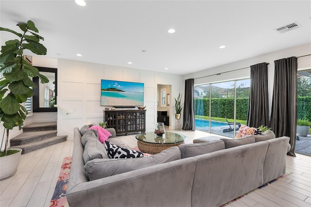 living room with light hardwood / wood-style flooring