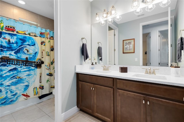 bathroom with shower / bath combination with curtain, vanity, and tile patterned floors