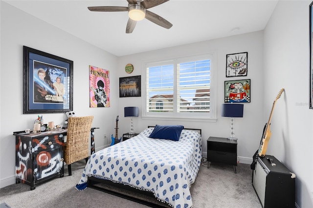 bedroom with ceiling fan and light colored carpet