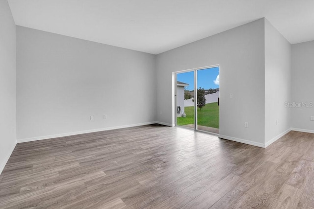 empty room with light hardwood / wood-style floors