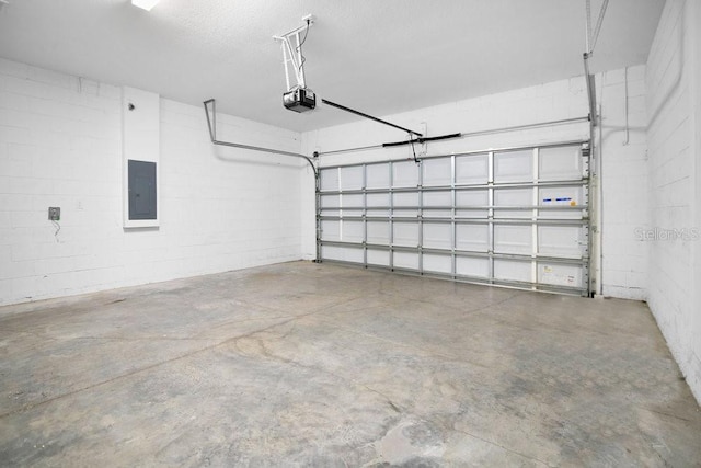 garage featuring electric panel and a garage door opener