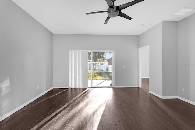 empty room featuring ceiling fan and dark hardwood / wood-style flooring