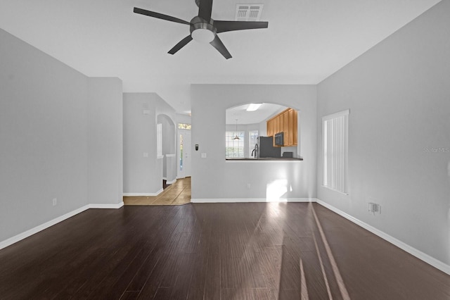 unfurnished living room featuring light hardwood / wood-style floors and ceiling fan