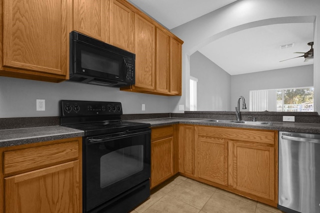 kitchen with lofted ceiling, black appliances, sink, ceiling fan, and light tile patterned floors