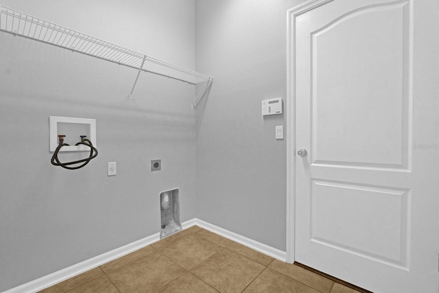 washroom featuring electric dryer hookup, tile patterned floors, and hookup for a washing machine