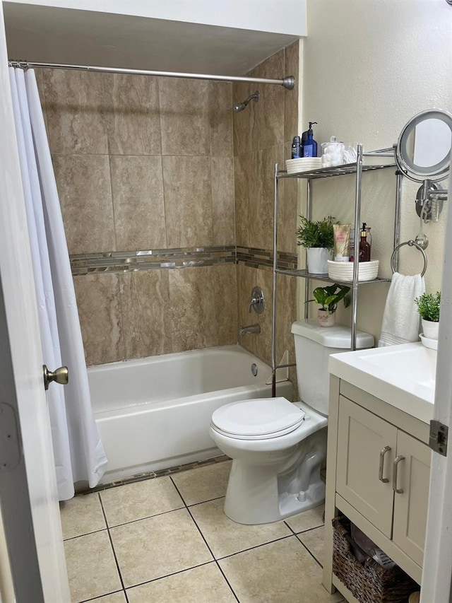 full bathroom with tile patterned floors, vanity, toilet, and shower / tub combo