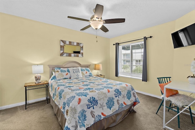 carpeted bedroom with ceiling fan and a textured ceiling