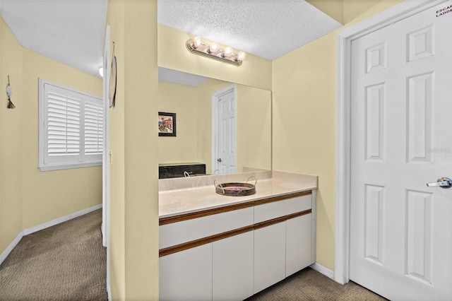 bathroom featuring vanity and a textured ceiling