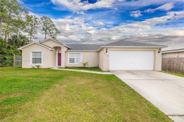 single story home featuring a garage and a front yard