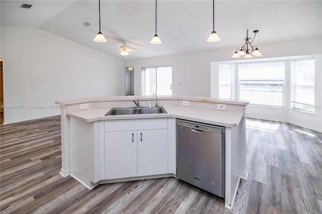 kitchen featuring dishwasher, white cabinetry, an island with sink, and a wealth of natural light