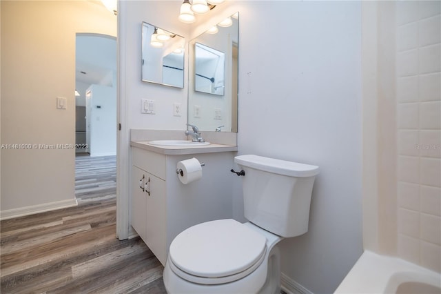 bathroom featuring vanity, toilet, and wood-type flooring