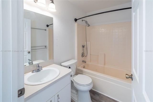 full bathroom with toilet, shower / washtub combination, vanity, and hardwood / wood-style flooring