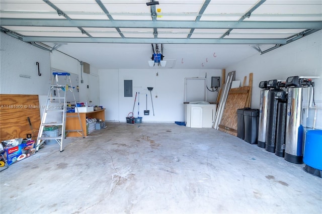 garage with electric panel and a garage door opener