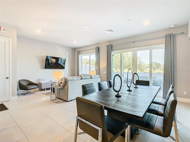 dining area featuring light tile patterned flooring