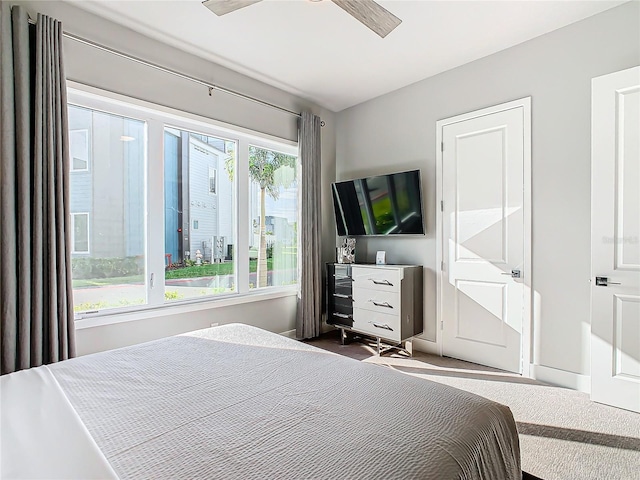 carpeted bedroom featuring ceiling fan