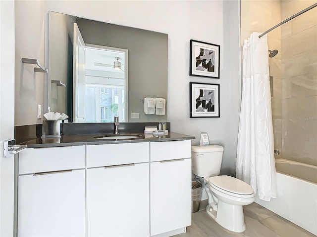 full bathroom with vanity, toilet, and shower / bath combo with shower curtain