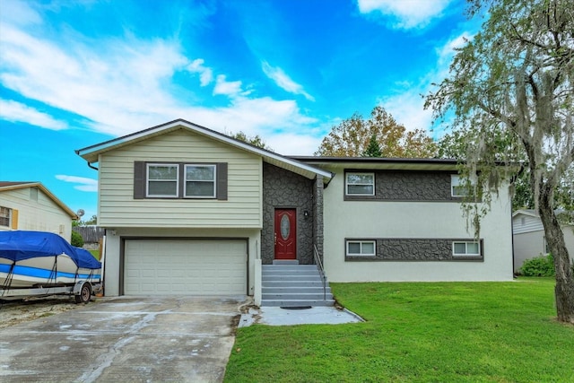 bi-level home with a garage and a front lawn