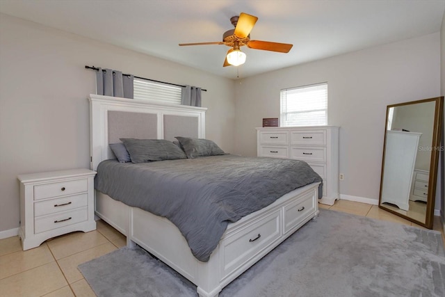 bedroom featuring ceiling fan and light tile patterned flooring