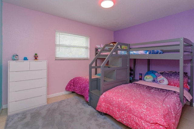 bedroom with light tile patterned floors