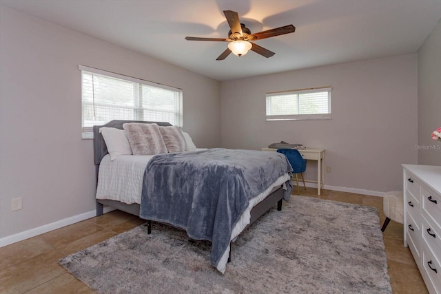 tiled bedroom with ceiling fan