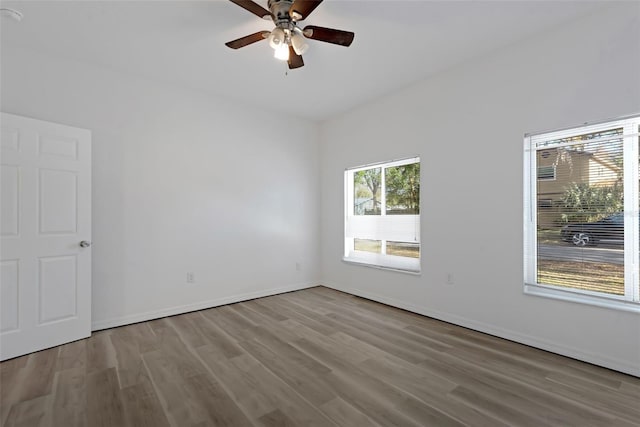 empty room featuring ceiling fan and light wood-type flooring