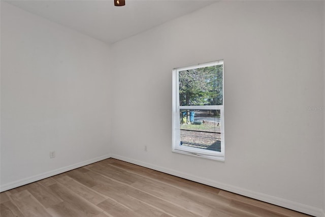 spare room featuring ceiling fan and light hardwood / wood-style flooring